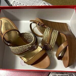 7.5 M size Coach Wedges gold/ginger in color
